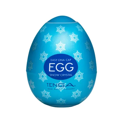 A light blue egg-shaped package reading EGG SNOW CRYSTAL TENGA, patterned with snowflakes